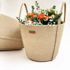Handcrafted jute planter basket with handles Eco-friendly jute plant holder Stylish indoor planter basket Natural jute rope plant pot cover Rustic decorative planter basket Large jute planter with handles Small eco-friendly plant basket Indoor plant decor basket Boho-style jute planter Versatile jute basket for plants